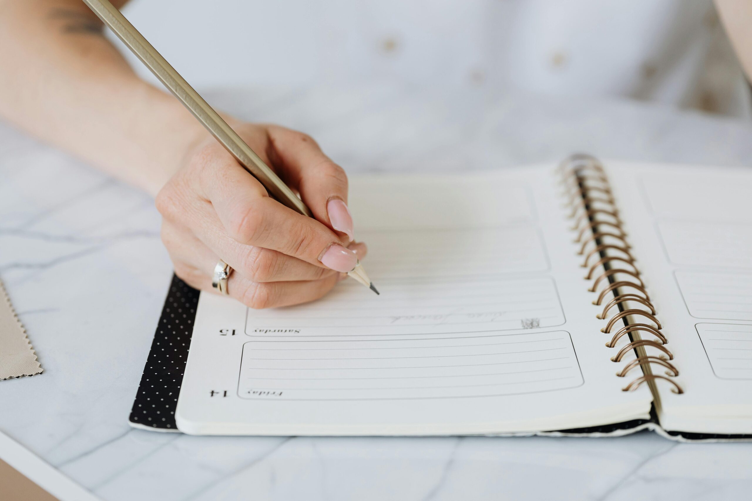 A confident entrepreneur in a coaching session, taking notes with a focused expression.