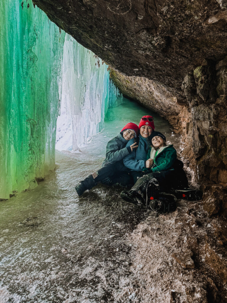 Family inside Midland Ice Caves New Brunswick with kids in winter